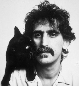 Frank Zappa poses with a cat in 1988. Location unknown. (AP Photo)